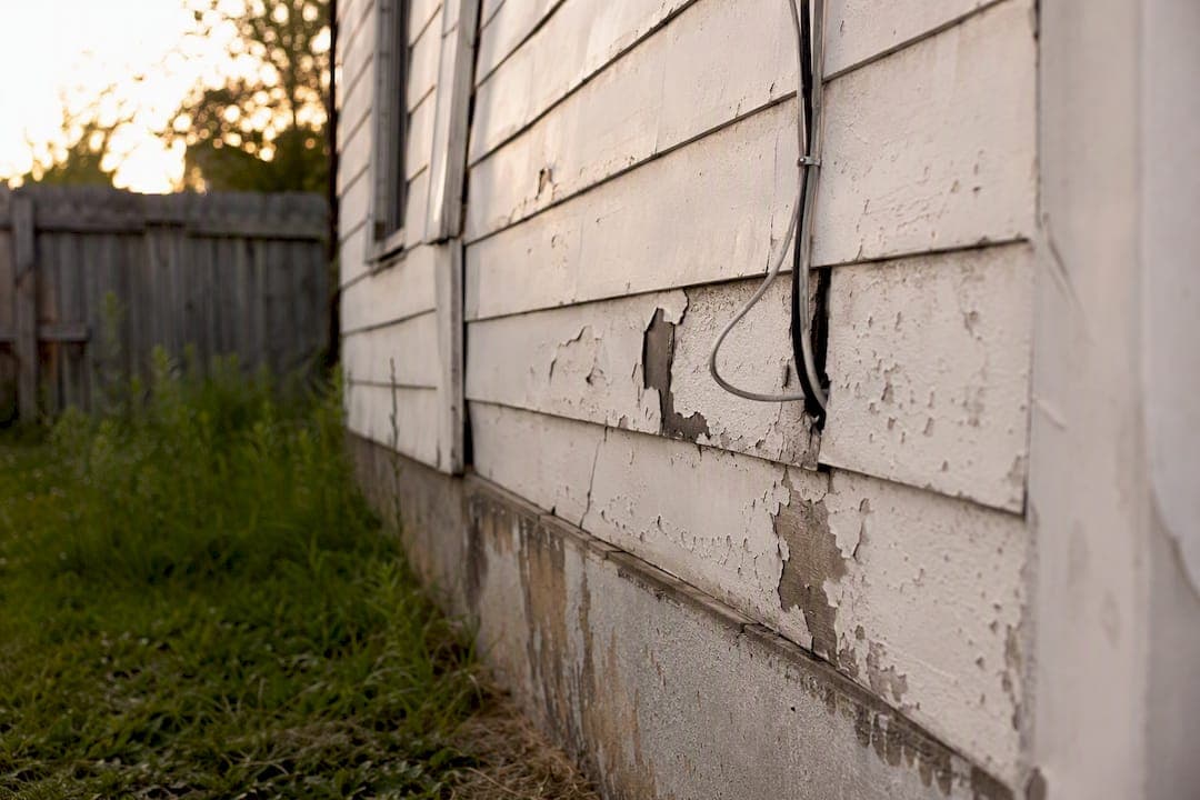 Close-up of home exterior showing code violation
