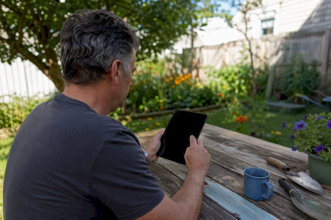 Homeowner reviewing cash offers on tablet