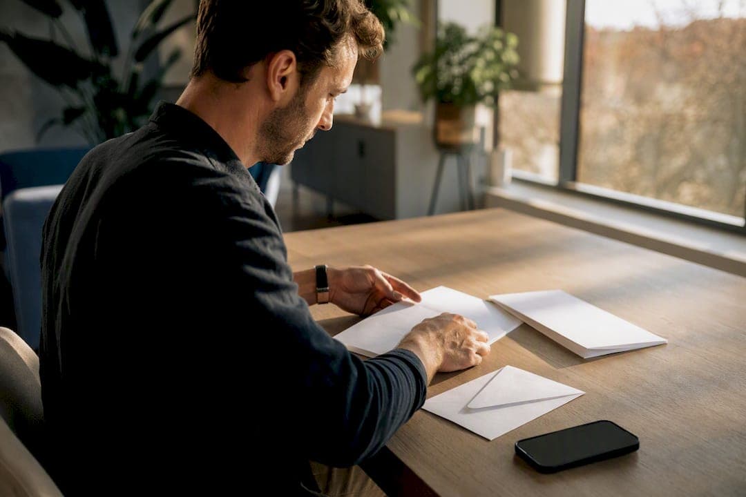 Agent preparing offer package at desk